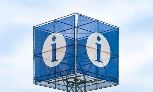 Blue sign with white "i" for information.