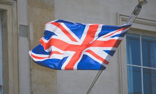 The UK flag blowing on a flagpole