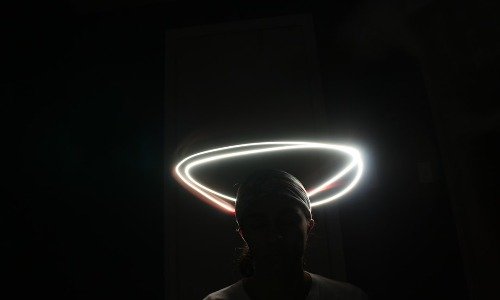 White light creating a halo around a head in shadow