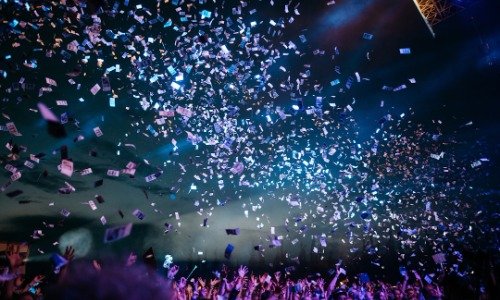 Confetti - blue and purple, against a dark background